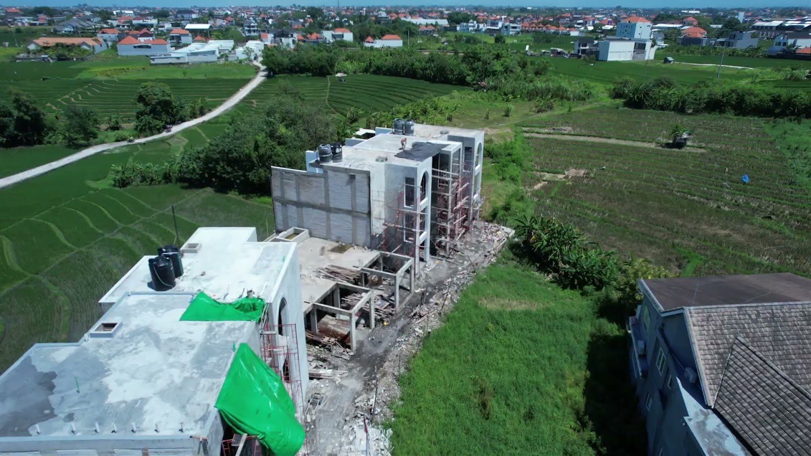 Ema Villas under construction, aerial over the paddies